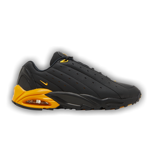 NOCTA x Nike Hot Step Air Terra 'Black University Gold'